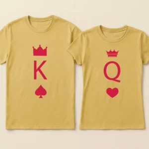 Black and white king queen matching couple t shirts featuring playing card design laid flat on a wooden surface.