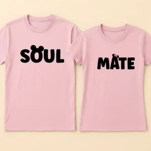 Matching Couple T-Shirts 12 Two pink personalized soulmate couple t shirts featuring black text with mouse ears and bow icons replacing letters.